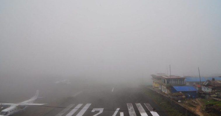 Low cloud and fog covering the Lukla valley causing flight delays on the Everest Base Camp trek route