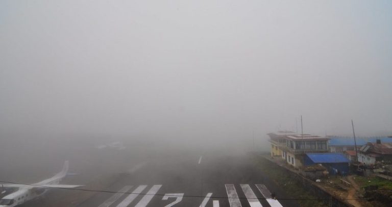 Low cloud and fog covering the Lukla valley causing flight delays on the Everest Base Camp trek route