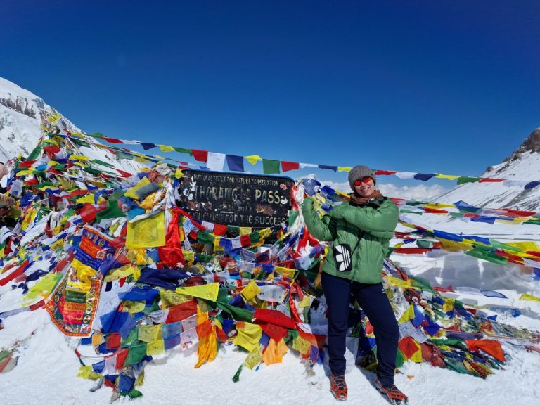 Female trekker at Thorong La Pass 5416m — Annapurna Circuit Nepal