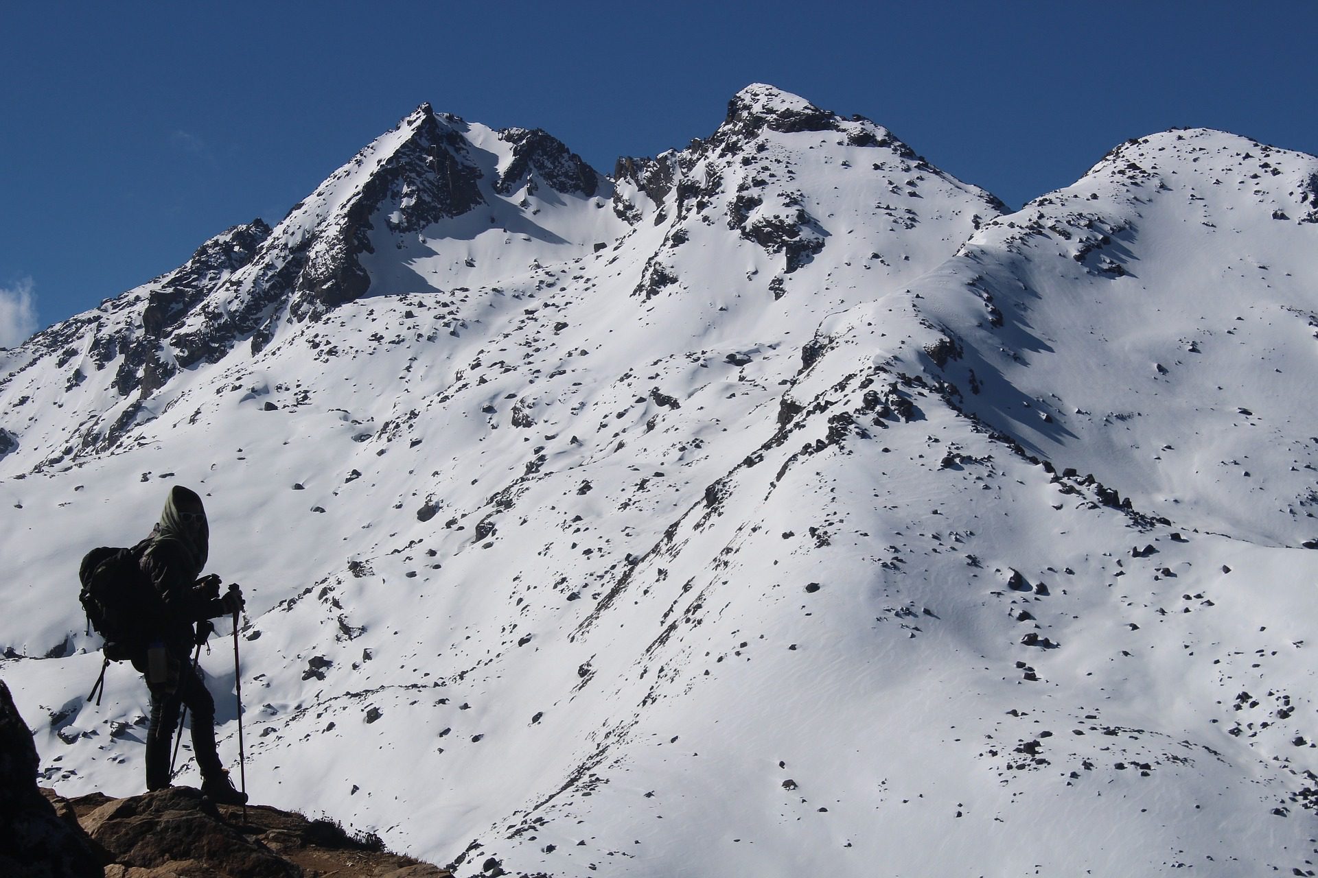 Trekker silhouette at altitude in the Himalayas Nepal