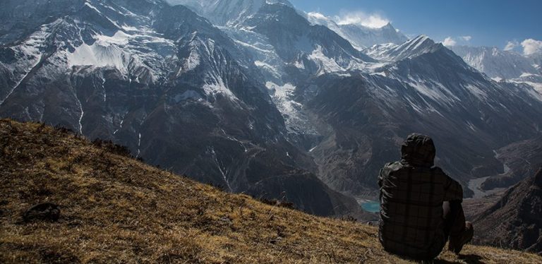Trekker enjoying the view on the way to Annapurna Circuit trek