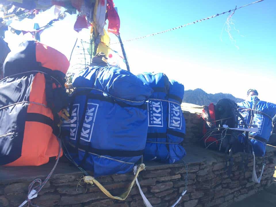 Duffel bag being carried by a porter on a MountainKick trek