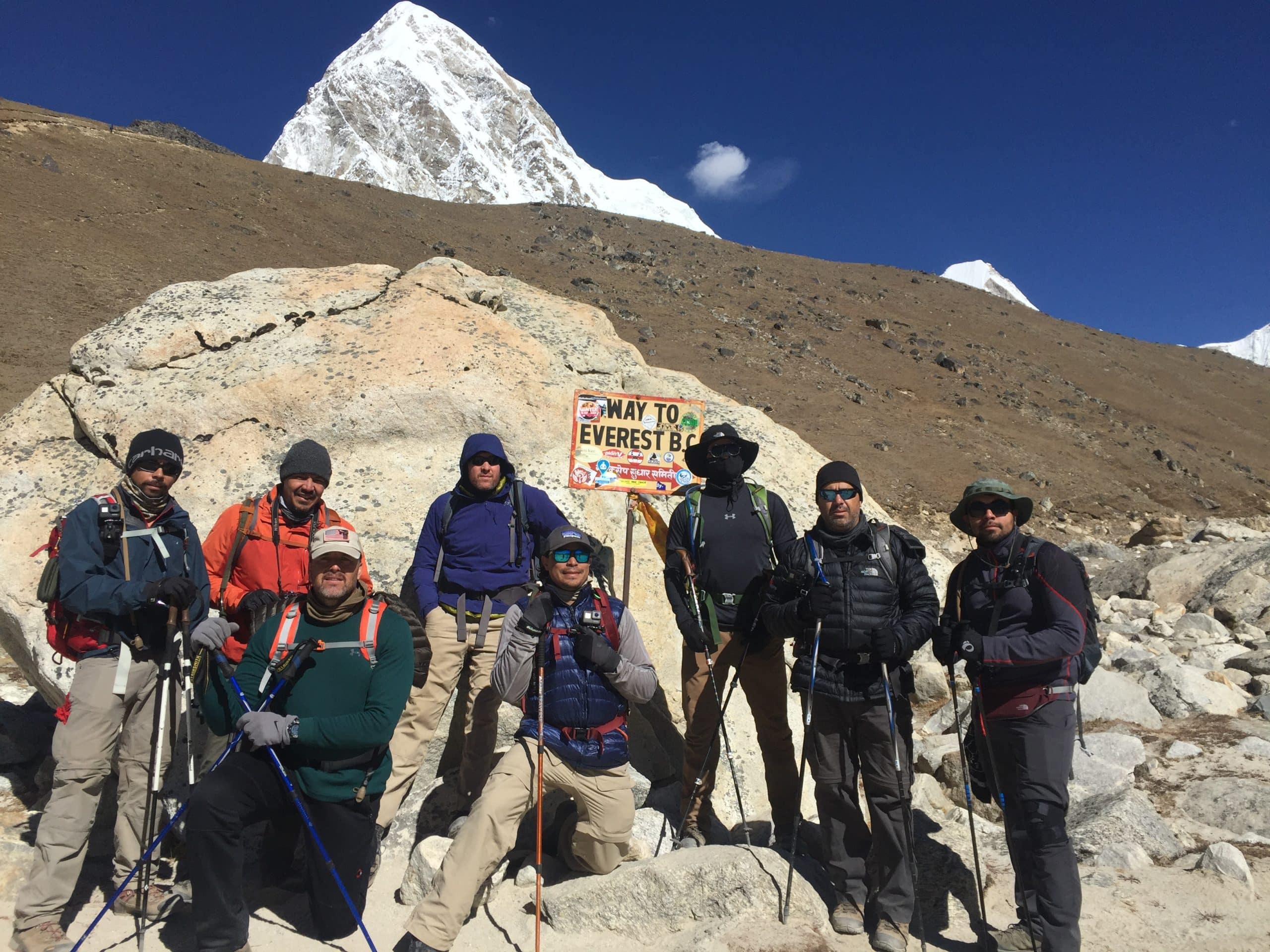 Trekkers in cold-weather gear near Pumori close to Gorak Shep Everest region Nepal