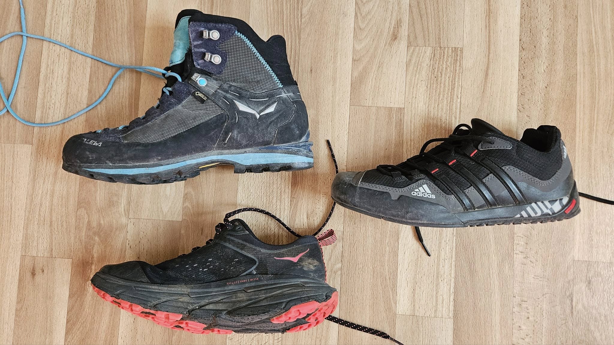 Different types of trekking footwear including boots, hiking shoes and trail runners