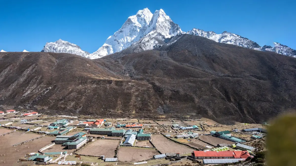 Panorama of Dingboche village and stone-walled fields below Ama Dablam