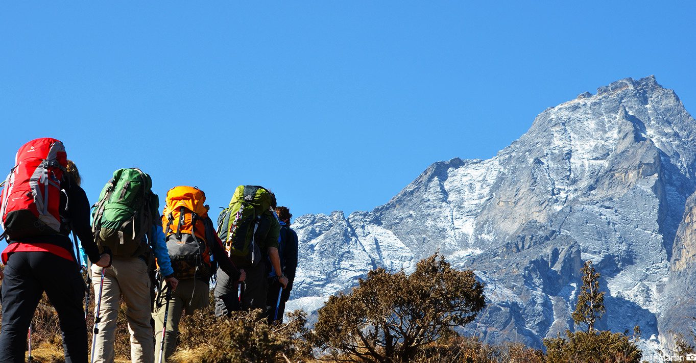 Group of trekkers on a mountain trail in Nepal with MountainKick