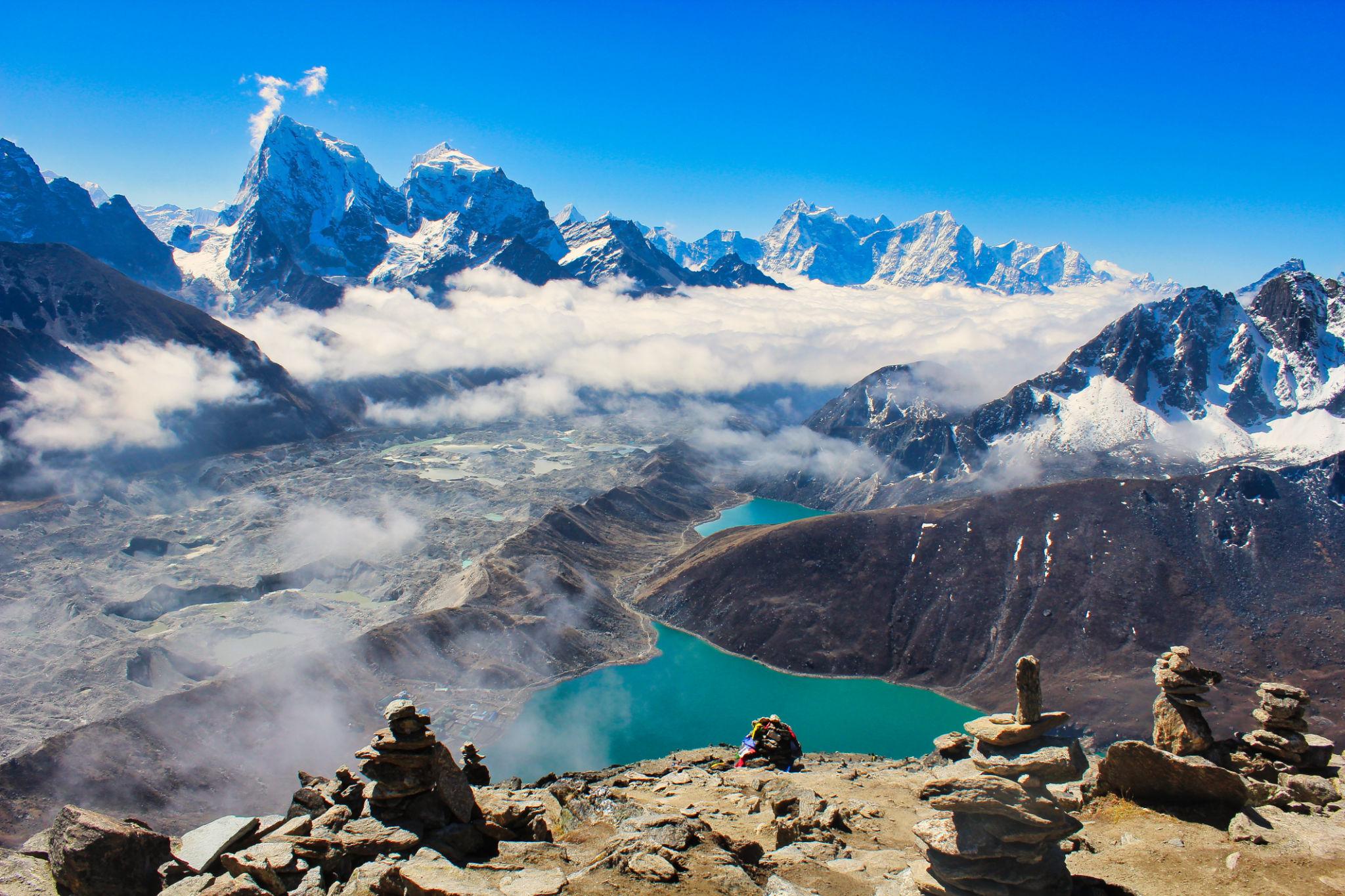 Trekkers climbing Gokyo Ri above the Gokyo Lakes