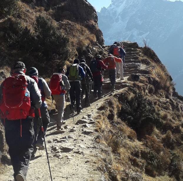 Trekkers walking in line on the Everest Base Camp trail, Nepal